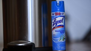 This illustration photo shows a bottle of Lysol disinfectant spray next to a trash can in Culver City, California, on April 24, 2020, amid the novel coronavirus pandemic.