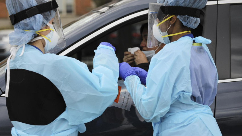 Norwegian Hospital nurses perform one of the first half dozen coronavirus tests on site in Chicago’s Humboldt Park neighborhood on Tuesday, April 28, 2020.