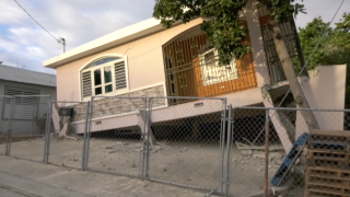 A damaged house sits in Guanica, Puerto Rico, after a 5.8 magnitude earthquake hit off the southern coast of Puerto Rico on Monday morning, Jan. 6, 2019.