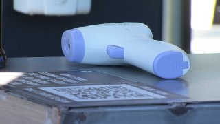 A temperature scanner at a San Diego restaurant awaits its next customer.