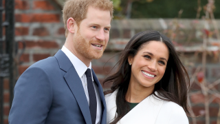 Meghan and Harry smile together