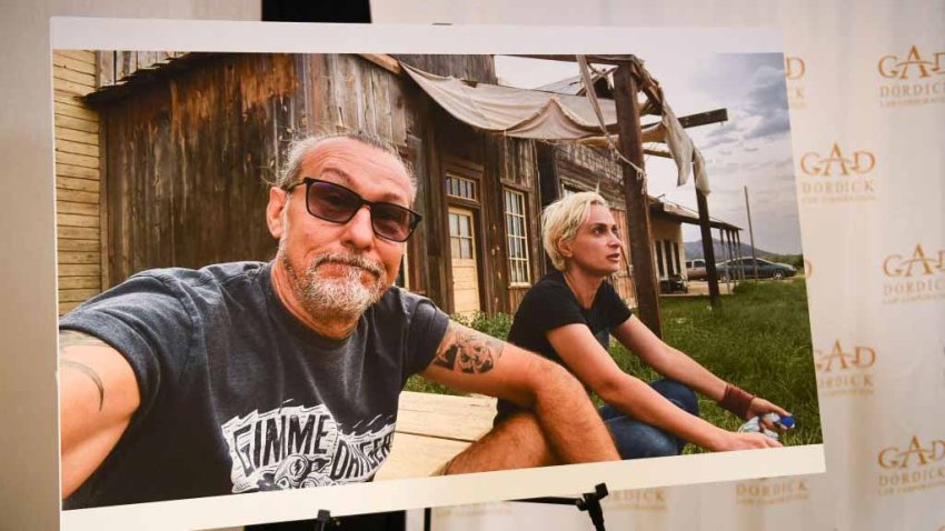 A photo of Serge Svetnoy and Halyna Hutchins is displayed after a press conference with attorney Gary Dordick (not pictured) and Serge Svetnoy, chief lighting technician for the film Rust, about a lawsuit filed after the fatal shooting on the film Rust during a press conference on November 10, 2021 in Los Angeles, California. – US actor Alec Baldwin is being sued by a “Rust” crew member over the fatal on-set shooting of a cinematographer last month, lawyers said Wednesday. (Photo by Patrick T. FALLON / AFP) (Photo by PATRICK T. FALLON/AFP via Getty Images)