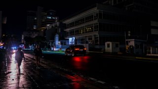 Power remains out at the Condado community of Santurce in San Juan, Puerto Rico, on Sept. 19, 2022, after Hurricane Fiona swept through the island. The storm strengthened to Category 3 as it headed for the Turks and Caicos Islands Tuesday.