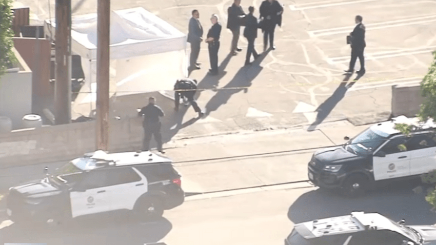 Aerial images show police officers investigating the discovery of human remains in Encino on Wednesday, Nov. 8, 2023.