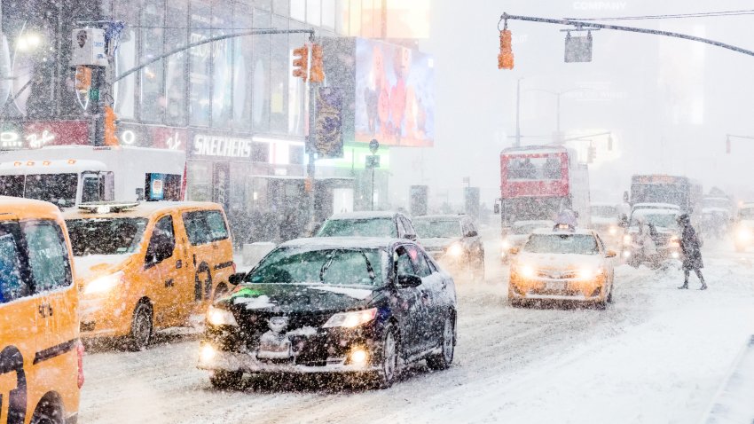 Heavy snow seen falling at Times Square. New York city is under heavy snow storm as a giant winter "bomb cyclone" walloped the East Coast of United States with freezing cold air and heavy snow