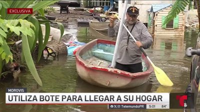 Bajo agua sector en Morovis: hombre solo puede llegar a su casa en bote