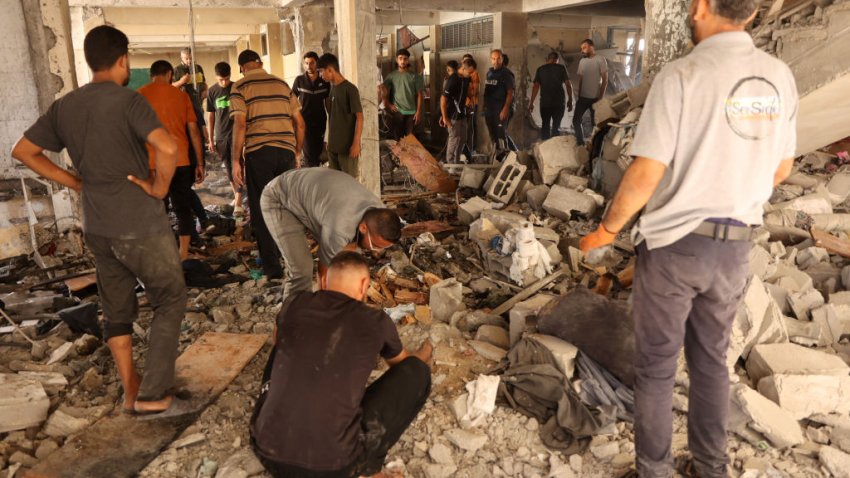 Palestinians inspect the damage at the site of an Israeli strike on a school housing displaced Palestinians in Gaza City’s Zaytoun neighbourhood on September 21, 2024. Gaza’s civil defence agency said an Israeli strike on a school-turned-shelter in the Palestinian territory’s largest city killed 19 people, while Israel’s military said it targeted Hamas militants. (Photo by Omar AL-QATTAA / AFP) (Photo by OMAR AL-QATTAA/AFP via Getty Images)