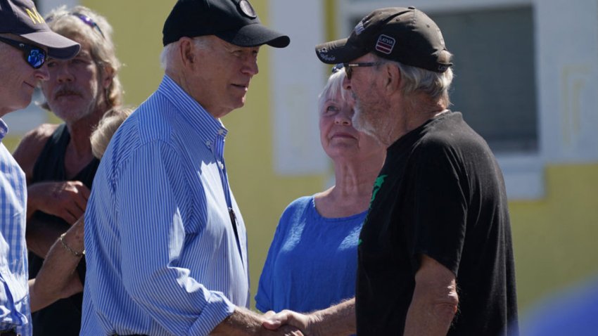 US President Joe Biden greets local residents as he surveys damage caused Hurricane Milton in St. Pete Beach, Florida, on October 13, 2024. The death toll from Milton rose to at least 16, officials in Florida said October 11, and millions were still without power as residents began the painful process of piecing their lives back together. (Photo by Bonnie CASH / AFP) (Photo by BONNIE CASH/AFP via Getty Images)