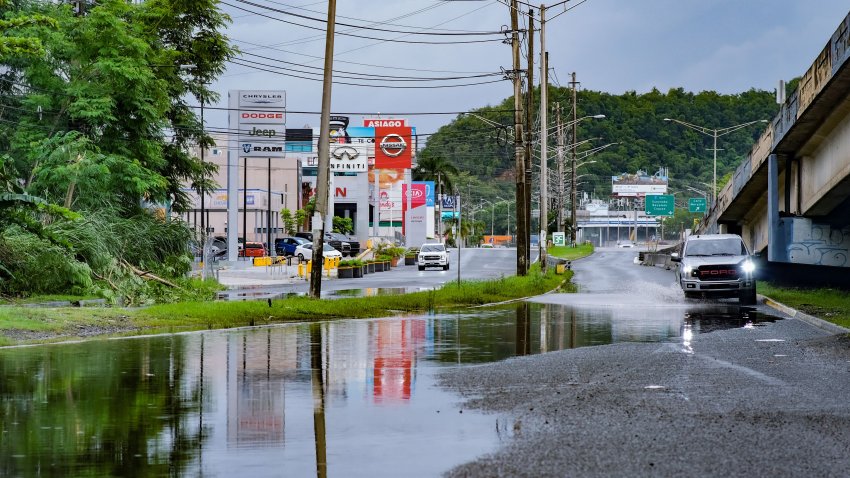 Cars drive on a flooded Ave Kennedy in San Juan, Puerto Rico, on September 19, 2022, after the passage of Hurricane Fiona. – Hurricane Fiona smashed into Puerto Rico, knocking out the US island territory’s power while dumping torrential rain and wreaking catastrophic damage before making landfall in the Dominican Republic on September 19. (Photo by AFP) (Photo by -/AFP via Getty Images)