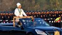 TOPSHOT – Myanmar’s military chief Min Aung Hlaing stands in a car as he oversees a military display at a parade ground to mark the country’s Independence Day in Naypyidaw on January 4, 2023. – Myanmar’s junta announced an amnesty for 7,000 prisoners to mark Independence Day on January 4 following a show of force in the capital, days after increasing democracy figurehead Aung San Suu Kyi’s jail term to 33 years. (Photo by AFP) (Photo by STR/AFP via Getty Images)