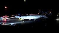 First responders surrounding a JetBlue plane at Boston's Logan International Airport during an incident Tuesday, Jan. 7, 2025.