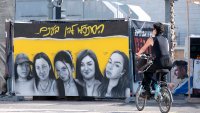 TEL-AVIV, ISRAEL – JANUARY 19: Drawings of hostages Liri Albag, Karina Ariev, Agam Berger, Daniella Gilboa, and Naama Levy are seen at Hostage Square on January 19, 2025 in Tel-Aviv, Israel.  (Photo by Noam Galai/Getty Images)