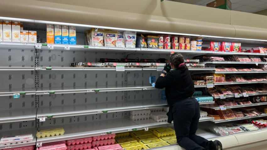 MIAMI, FLORIDA – JANUARY 23: A grocery store worker rearranges items in the depleted egg section of a grocery store on January 23, 2025 in Miami, Florida. Grocery stores across the nation are running short on eggs, and the situation may not improve for months. The avian influenza has killed as many as 17.2 million egg-laying hens, causing an egg shortage.  (Photo by Joe Raedle/Getty Images)