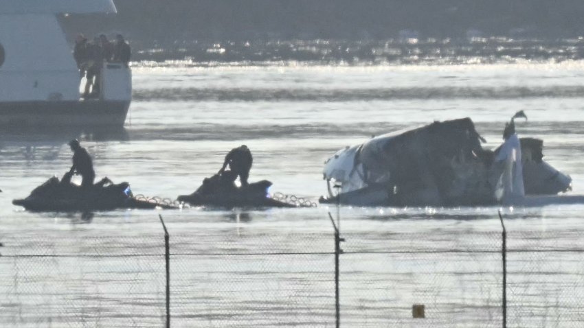 Part of the wreckage is seen as rescue crews search the waters of the Potomac River American Airlines flight 5342 on approach to Reagan National Airport crashed into the river after colliding with a US Army helicopter, near Washington, DC, on January 30, 2025. There are likely no survivors from a collision between a passenger jet and US Army helicopter in Washington, officials said Thursday, as recovery operations pulled 28 bodies from the river into which both crashed. (Photo by ANDREW CABALLERO-REYNOLDS / AFP) (Photo by ANDREW CABALLERO-REYNOLDS/AFP via Getty Images)