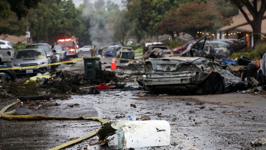 A street is littered with debris where a small plane crashed  into San Diego, California, residential street on May 22, 2025. The Federal Aviation Authority said a Cessna 550 crashed at around 3:45 am local time. The neighborhood is close to the Montgomery-Gibbs Executive Airport. The crash left a “gigantic debris field” and damaged some 15 homes and parked cars, ABC News quoted the San Diego assistant fire chief as saying. (Photo by Sandy Huffaker / AFP) (Photo by SANDY HUFFAKER/AFP via Getty Images)