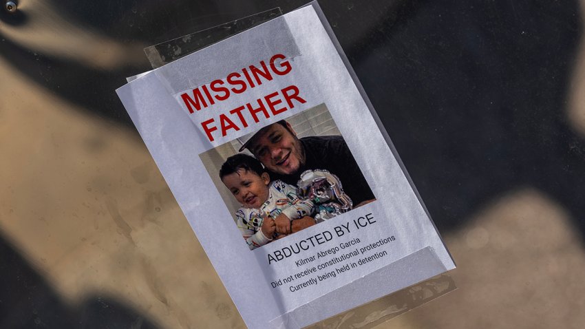 LOS ANGELES, CALIFORNIA – JUNE 12: Marchers stop to look at flyers with photos of people who have been arrested by ICE, included this one for Kilmar Abrego Garcia, attached to a mirrored sculpture outside the Japanese American National Museum as protests continue in an approximately one-square mile area of downtown Los Angeles in response to a series of immigration raids on June 12, 2025 in Los Angeles, California. Protests escalated after President Donald Trump authorized military forces to protect federal property against the wishes of city and state officials who say that the Los Angeles police have the expertise and decades of experience to handle large protest crowds. National Guard troops have so far played no role in quelling violence in the streets, according to Mayor Bass, but are stationed to guard federal buildings.  (Photo by David McNew/Getty Images)