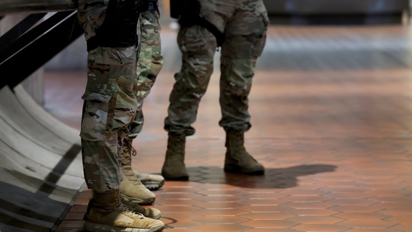 National Guard members from Ohio stand by the entrance to the Waterfront Metro Station on Aug. 26, 2025.